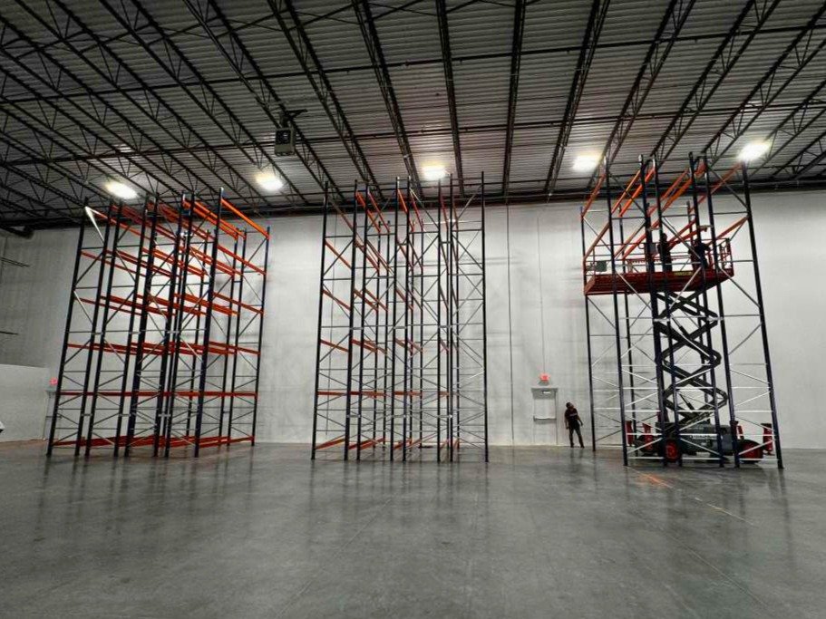 Before — warehouse during rack installation by Orozco's crew