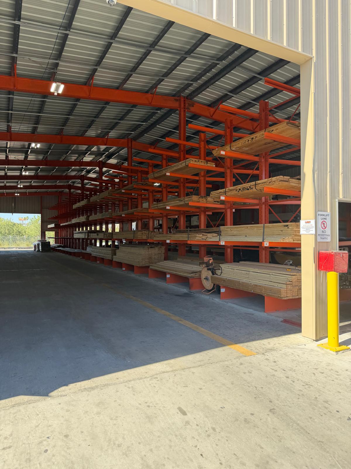 Cantilever rack system loaded with lumber — Orozco's Racks installation South Texas