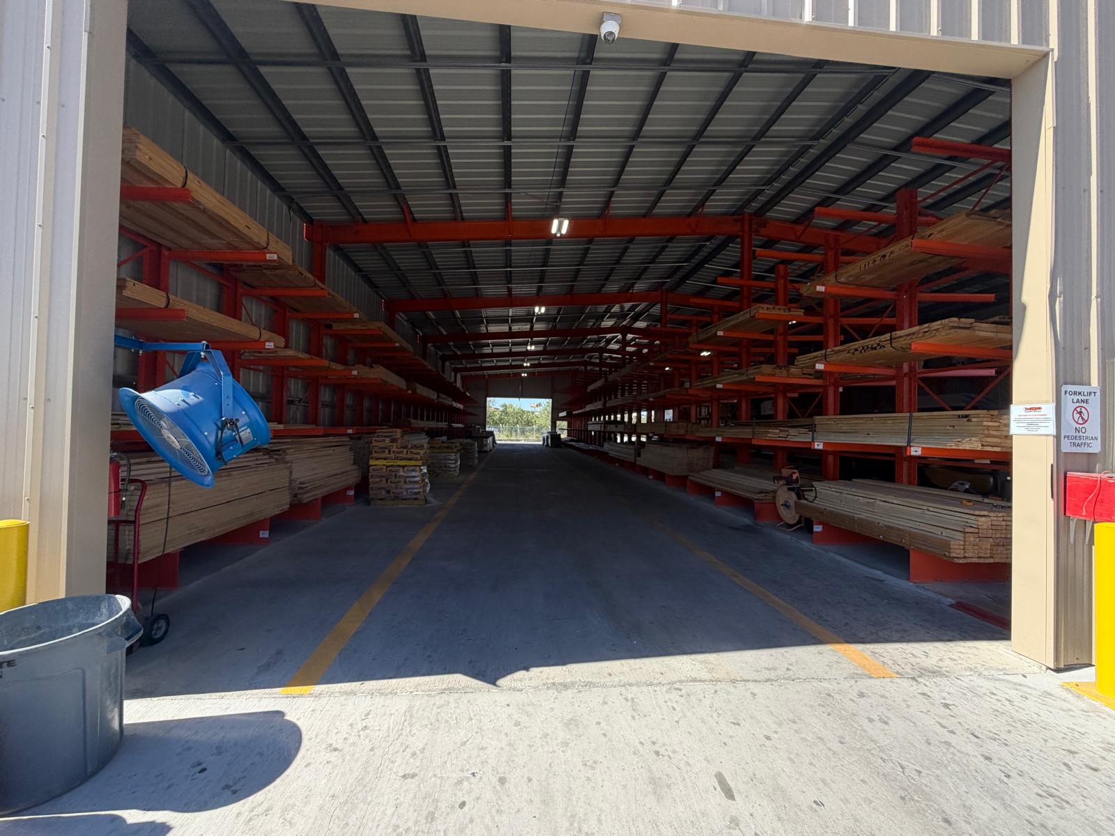 Cantilever racks loaded with lumber — indoor covered yard
