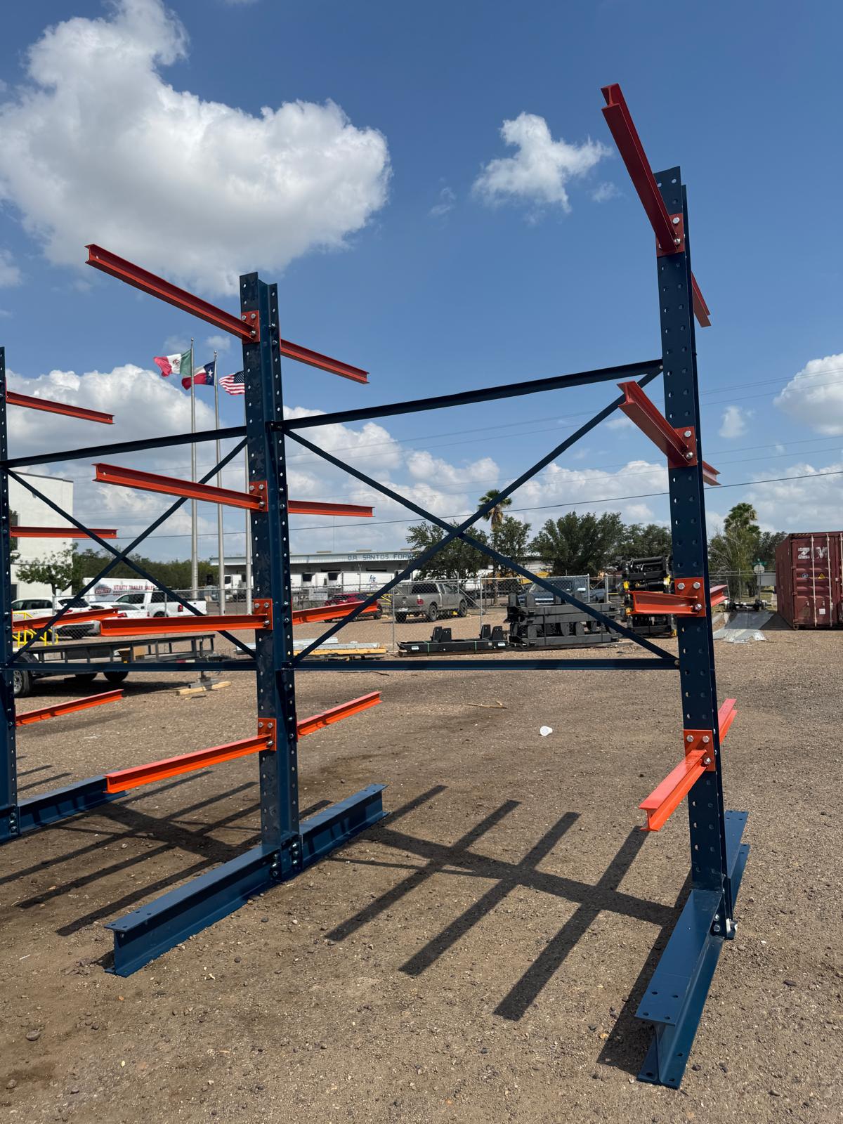 Row of outdoor cantilever racks — navy and orange