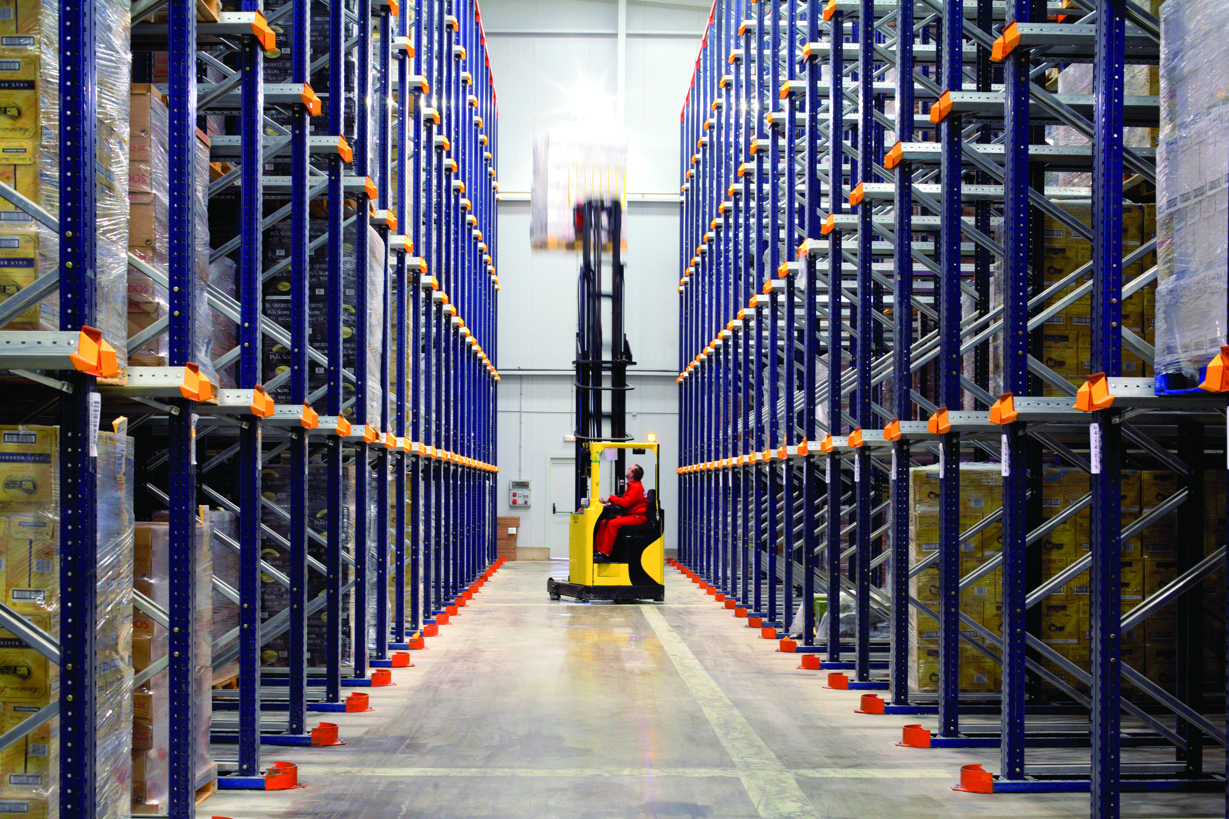 Drive-in rack aisle with forklift operating — Mecalux system