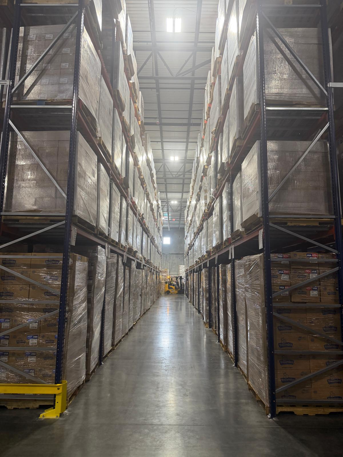 Selective racks with forklift operating in aisle