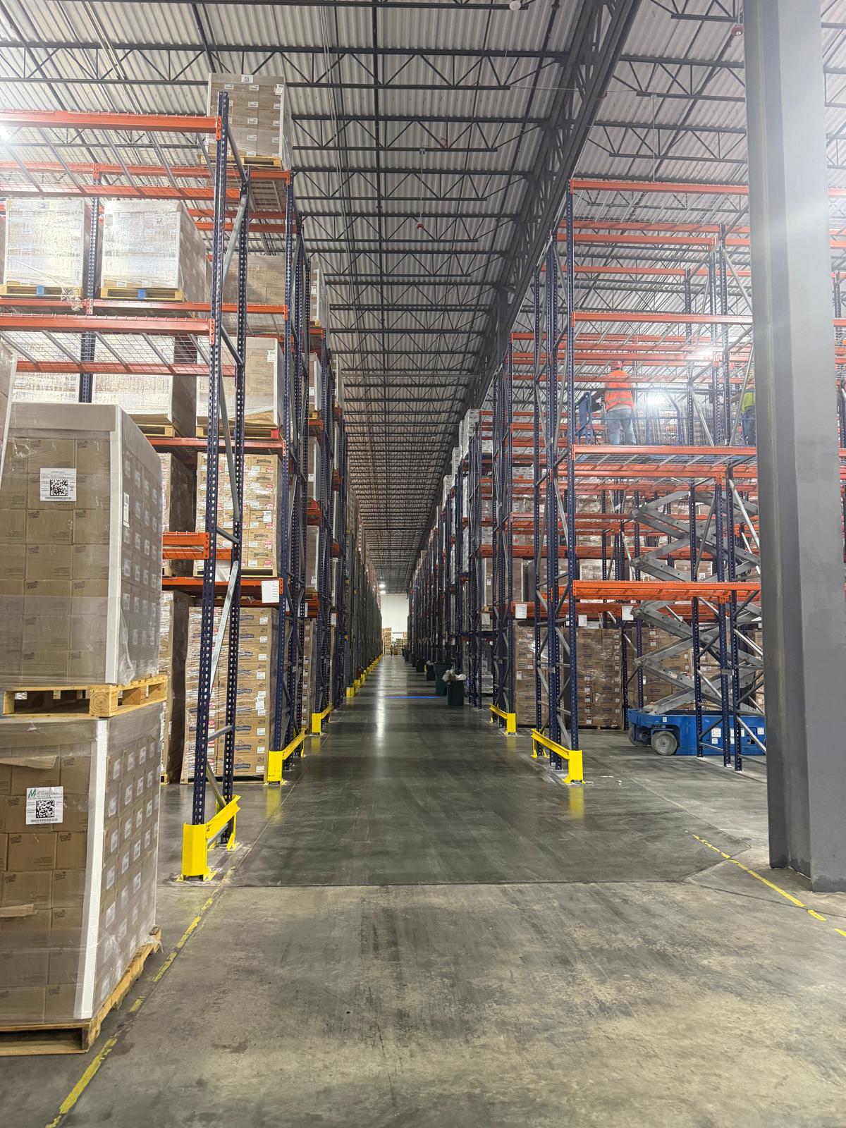 Installation crew working on selective pallet racks