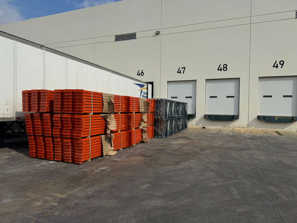 Rack beams and uprights staged at warehouse receiving docks