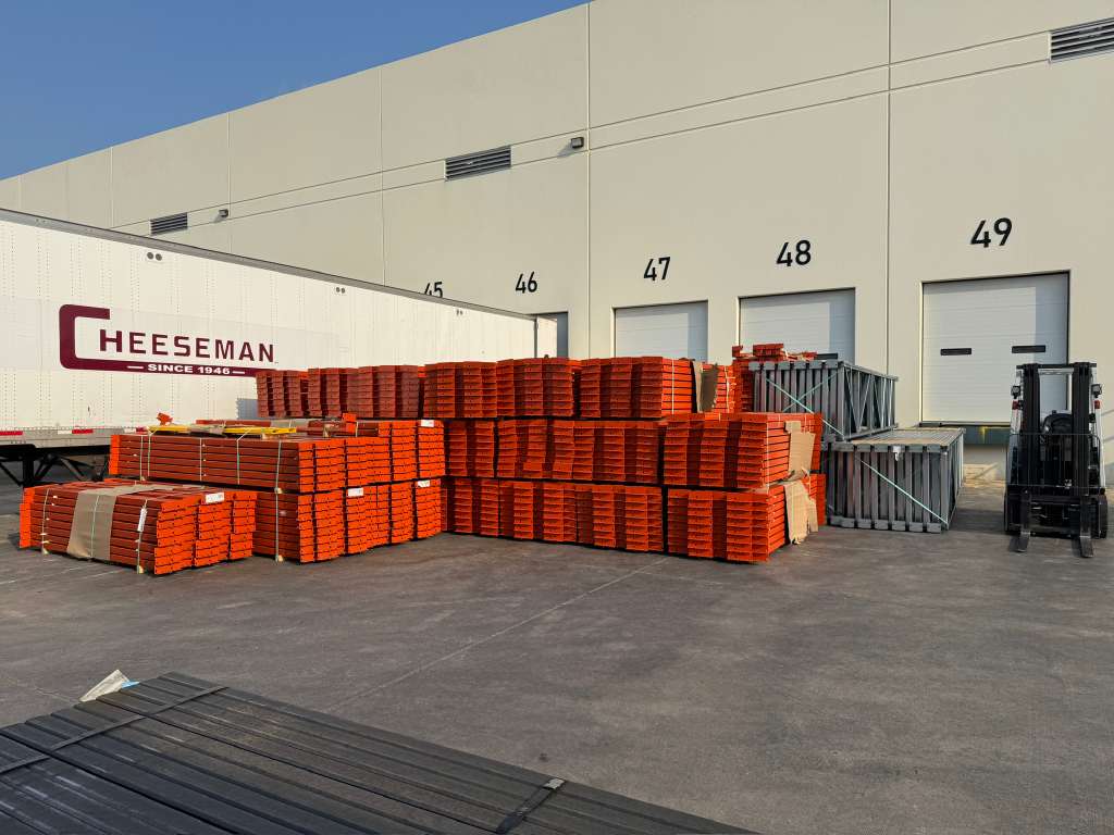 Rack components staged at warehouse docks — Orozco's Racks freight delivery