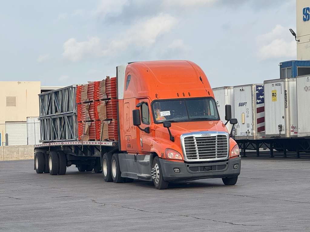 Rack freight delivery — flatbed truck with rack components